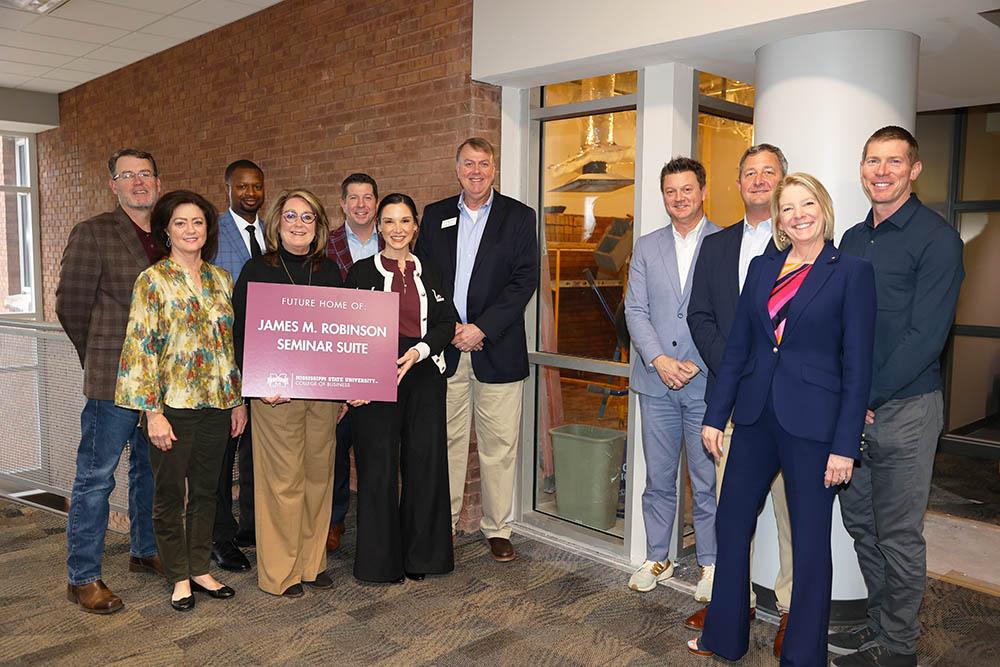 Marketing Advisory Board standing in front of the future home of the James Robinson Seminar Suite