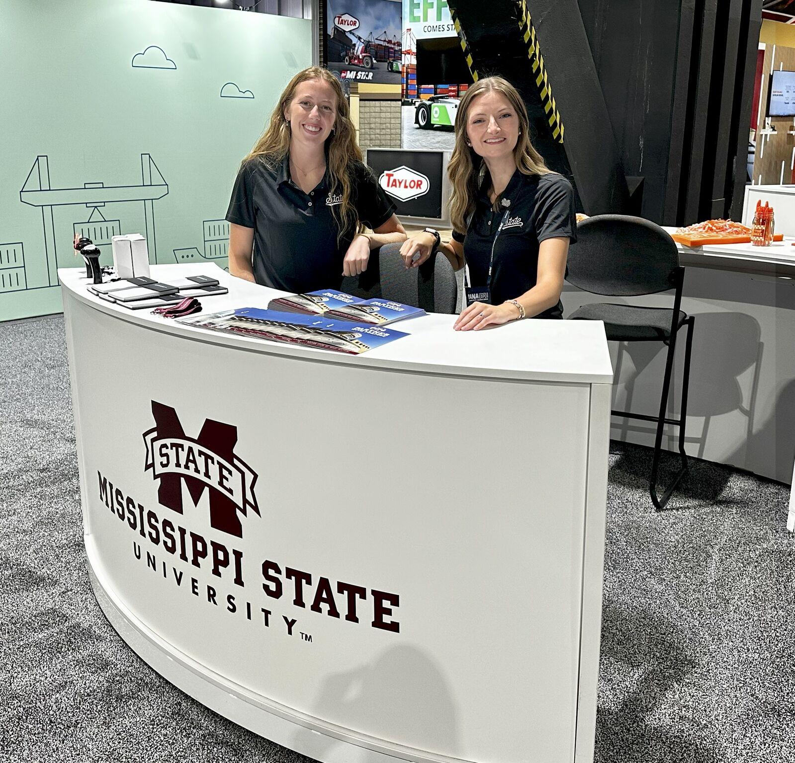two students smiling